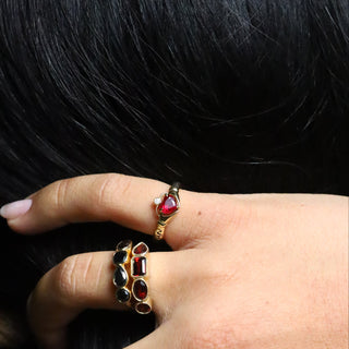 0.88ct Ruby Sempre Ring worn on the hand against a dark background