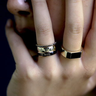 Hand stacked with a beaded silver band, the Til Death Gold Band and the 4mm black enamel Til Death band
