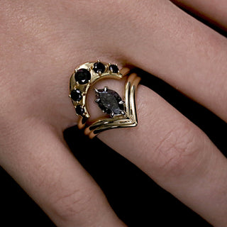Black Diamond Crescendo Stacking Band with a marquise galaxy diamond ring on a V-shaped double shank, dark background