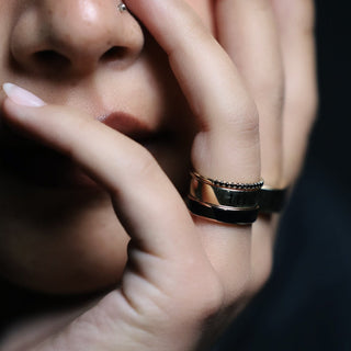 Black Diamond Whisper Half Eternity Band worn in a Til Death World ring stack, hand held near the face