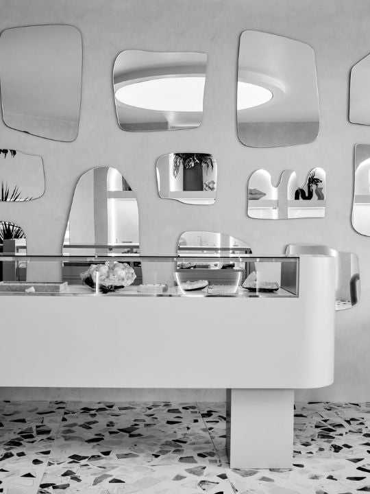 Black and white image of showroom interior