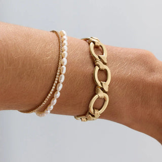 Everyday Pearl Bracelet on wrist styled with other Marrow Fine bracelets