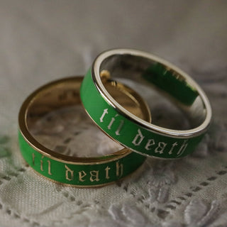 Scheele's Green yellow gold and white gold til death enamel bands on a lace fabric background
