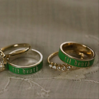 scheele's green til death band in gold and silver, with two gold diamond rings