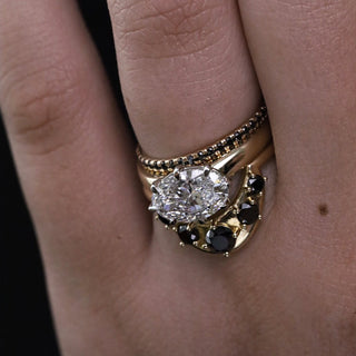 Ophelia lab-created diamond engagement ring with an east-west oval, stacked with the Black Diamond Whisper band and Black Diamond Crescendo Stacking Band