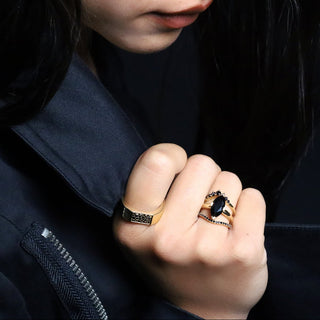 Black Diamond Colson Band worn on the hand against a dark background