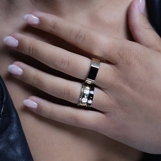 Elton Enamel Men's Band stacked with a thin gold band and a textured silver band