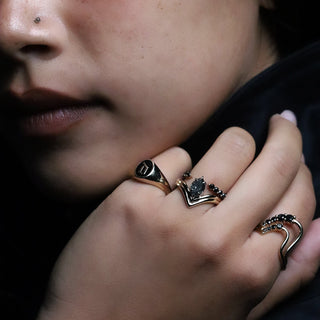 Yellow gold Initial Enamel Signet Ring with the letter D worn as a pinky ring, stacked with the Black Diamond Lucy and Mini Lucy Wave Bands